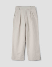 MHL. PLEATED CROP TROUSERS | DRY COTTON LINEN | PALE STONE